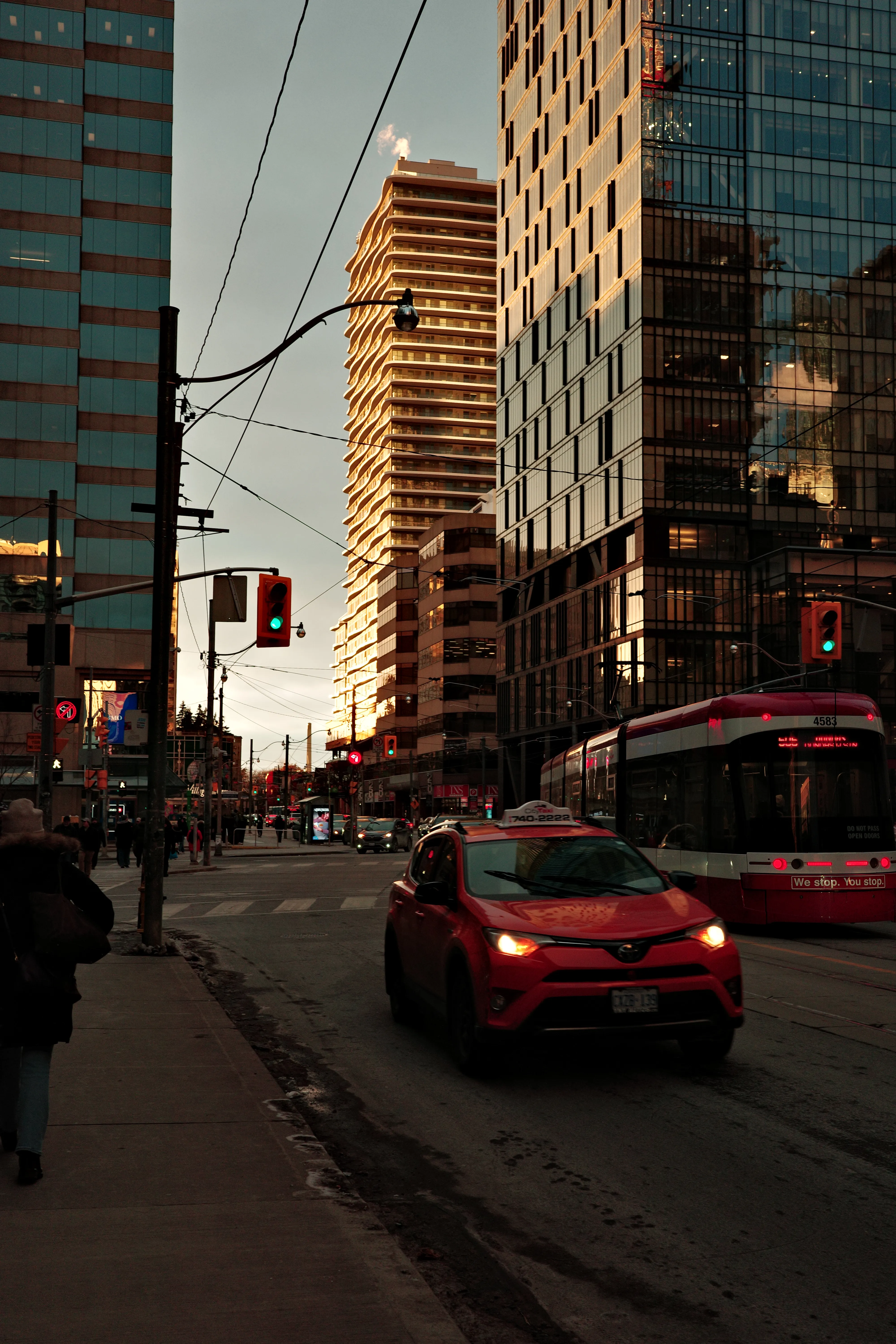 Photo of an image of Queen Street on Ontario with a streetcar and some other vehicles