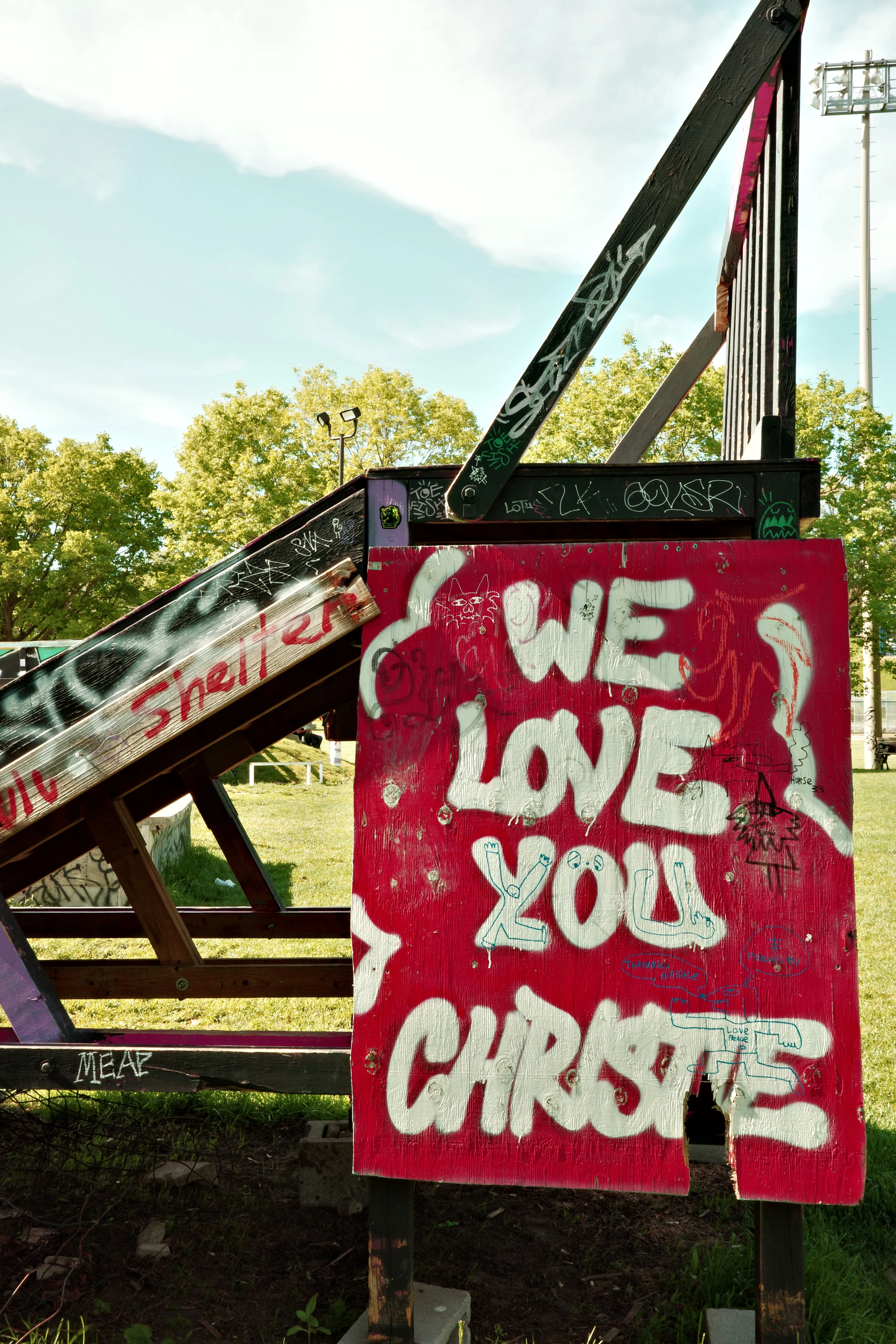 Photo of a sign at Christie Pits that says "We love you Christie"