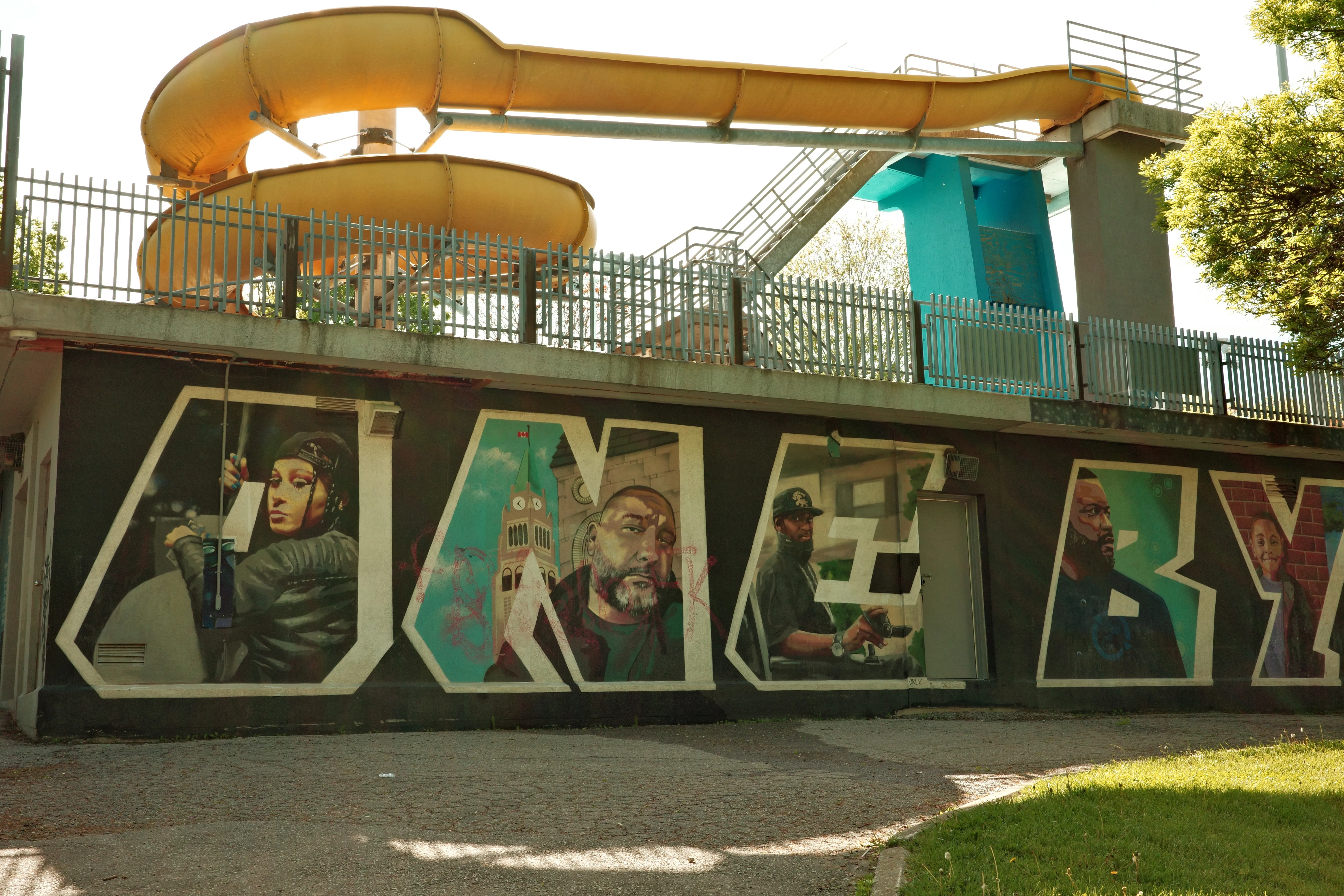 Photo of mural and slide at Christie Pits